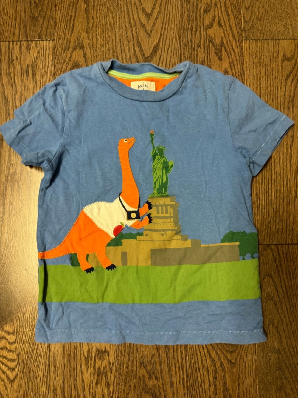 Mini Boden Light Blue Tee with Orange Dinosaur and Green Statue
